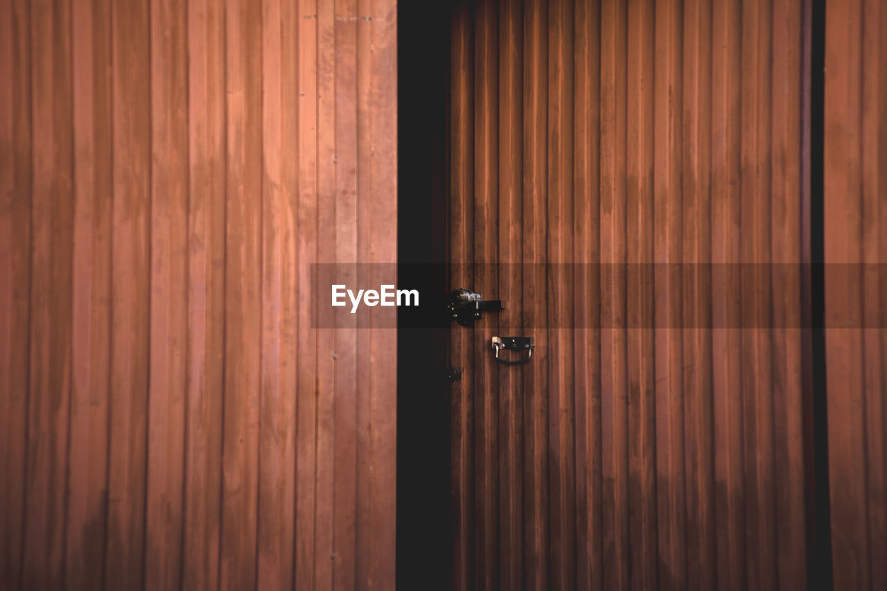 Full frame shot of open wooden door