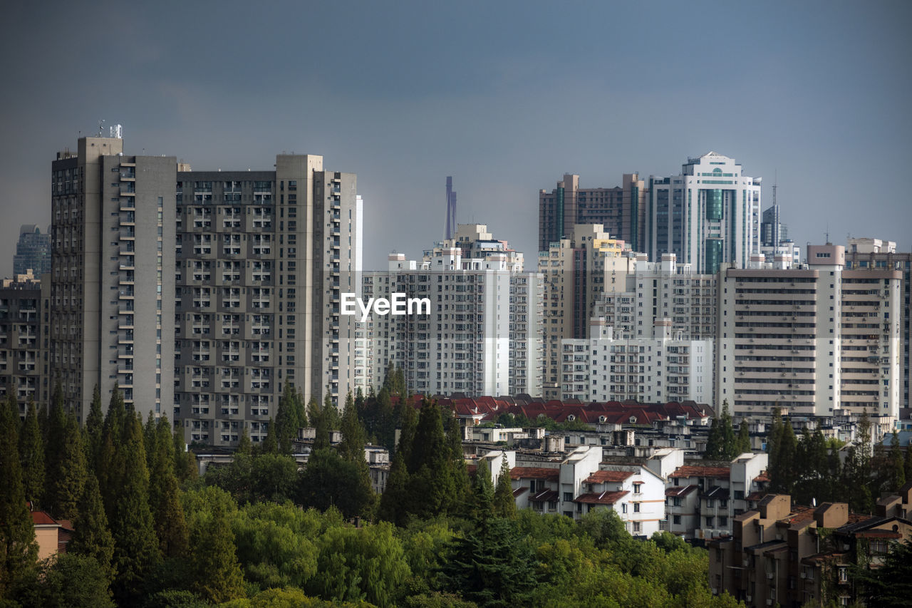 Buildings in city against sky