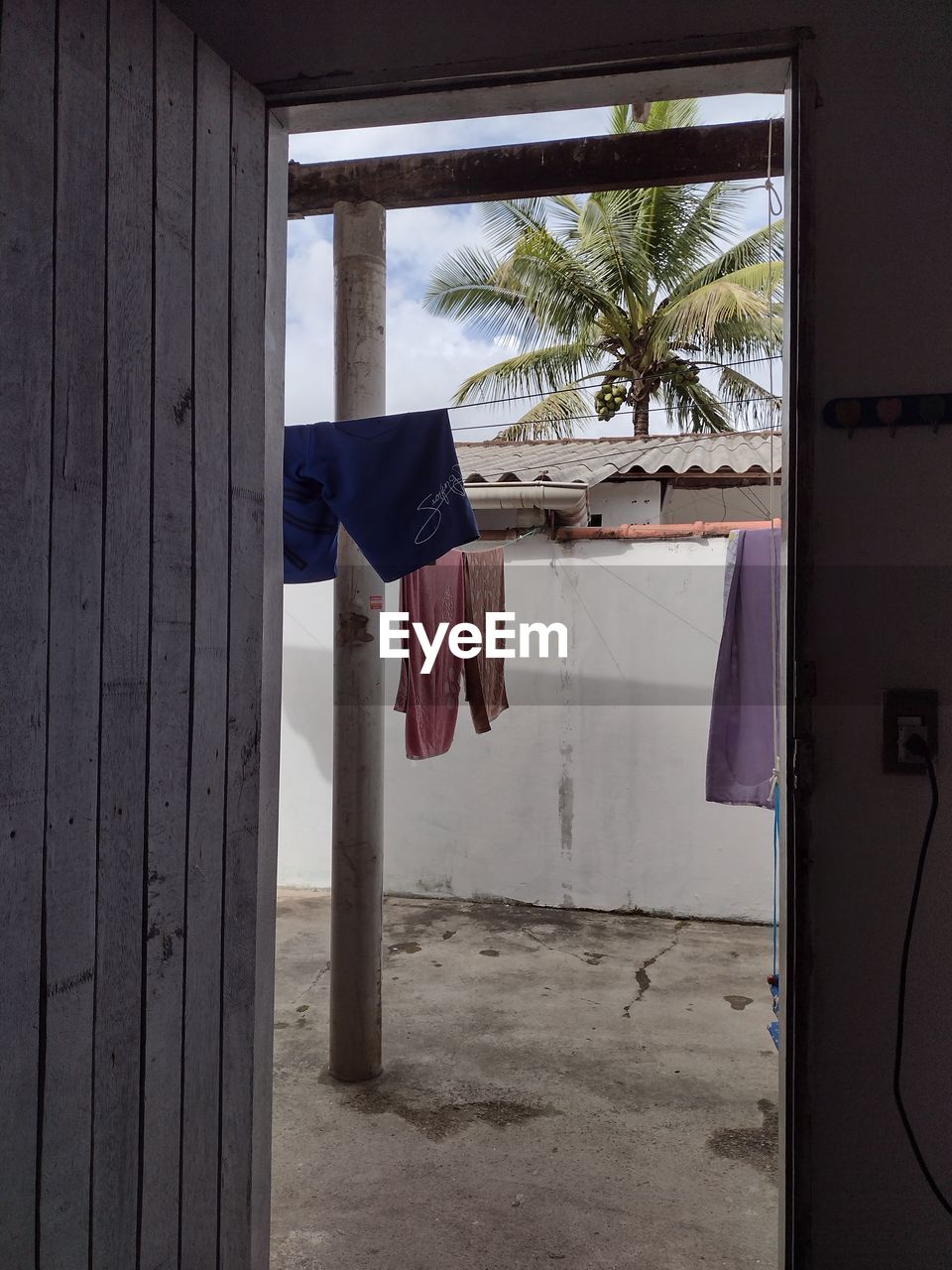 CLOTHES DRYING OUTSIDE HOUSE