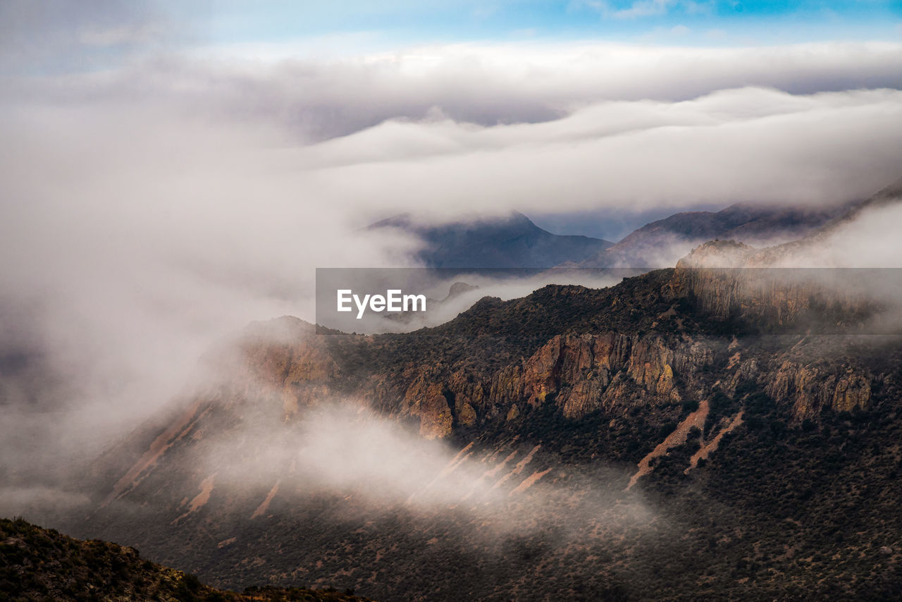 Scenic view of foggy mountain against sky in big bend national park - texas