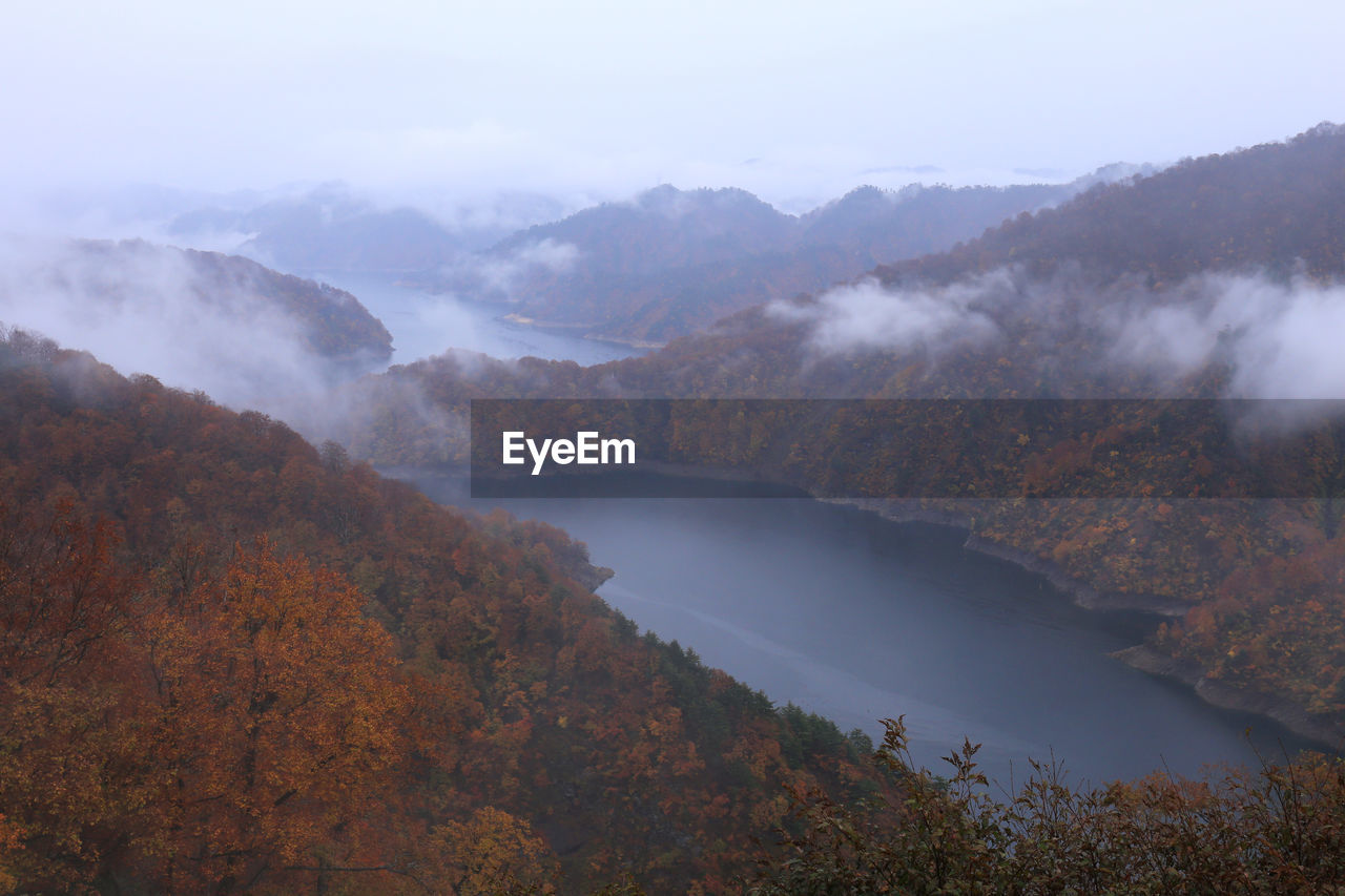 Scenic view of lake and mountains during autumn