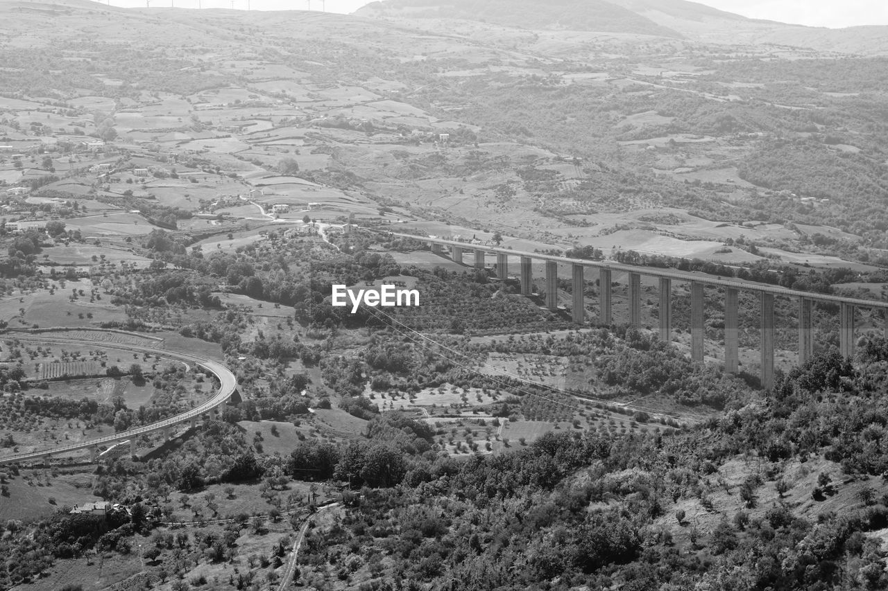 HIGH ANGLE VIEW OF ROAD BY LANDSCAPE