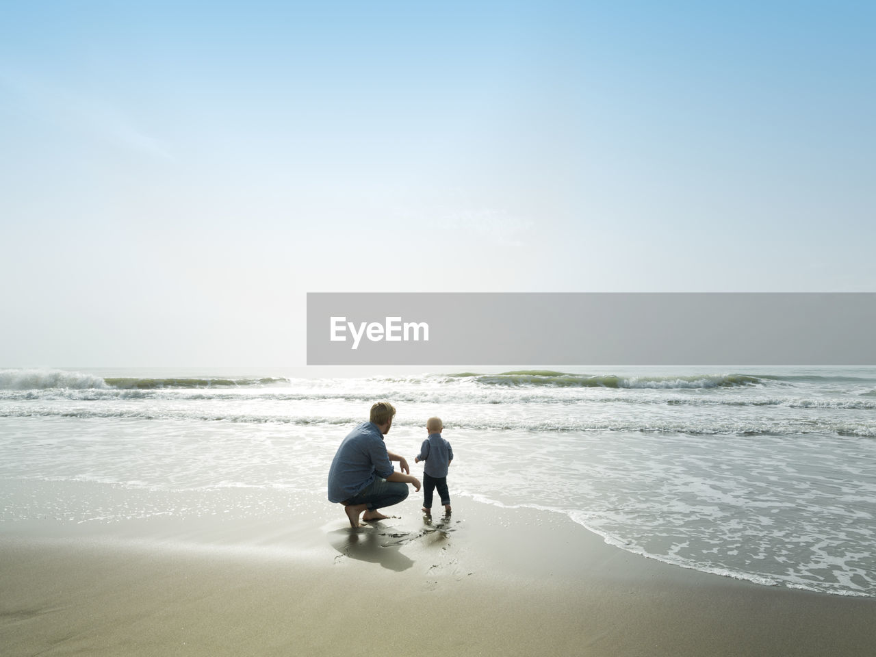 Father and son on a beach day, bajondillo beach in torremolinos,