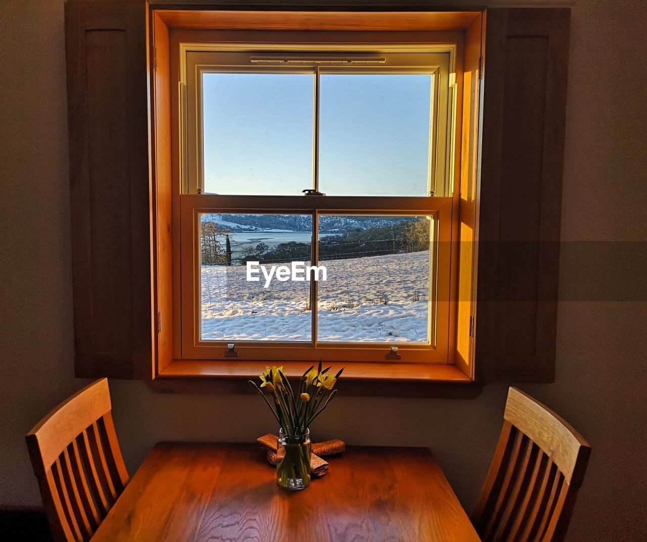 Chairs and table by window at home