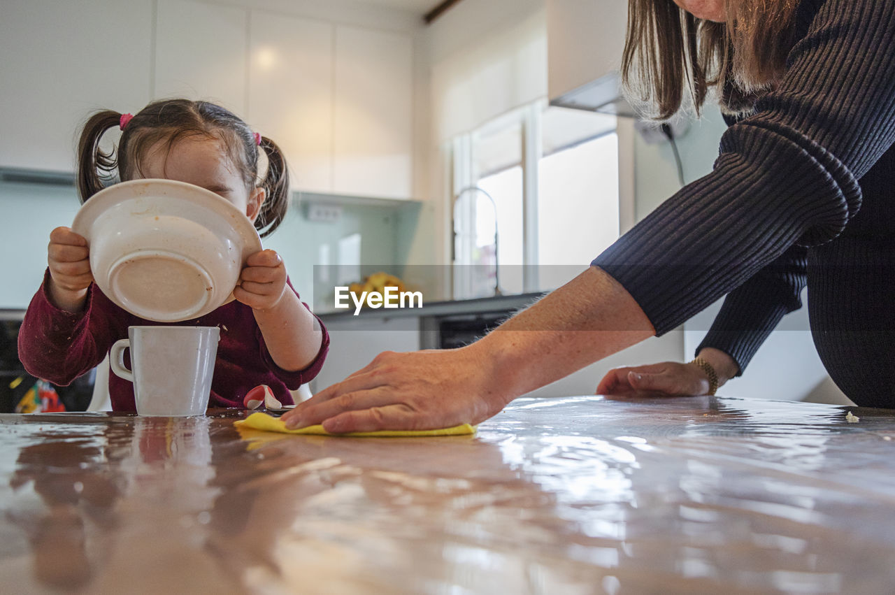 Mother with daughter in kitchen