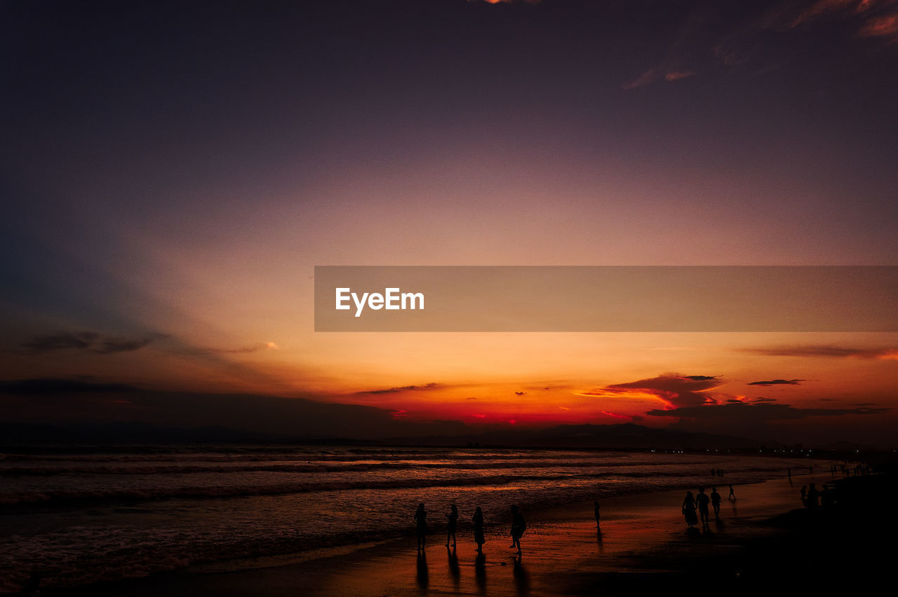 Scenic view of sea against romantic sky at sunset