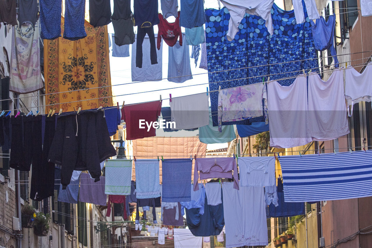 CLOTHES DRYING ON MARKET STALL