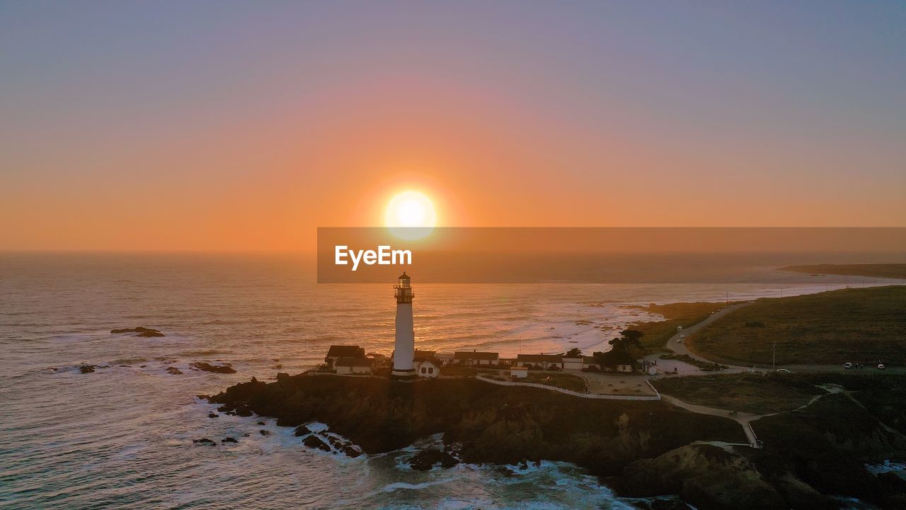 SCENIC VIEW OF SEA AT SUNSET