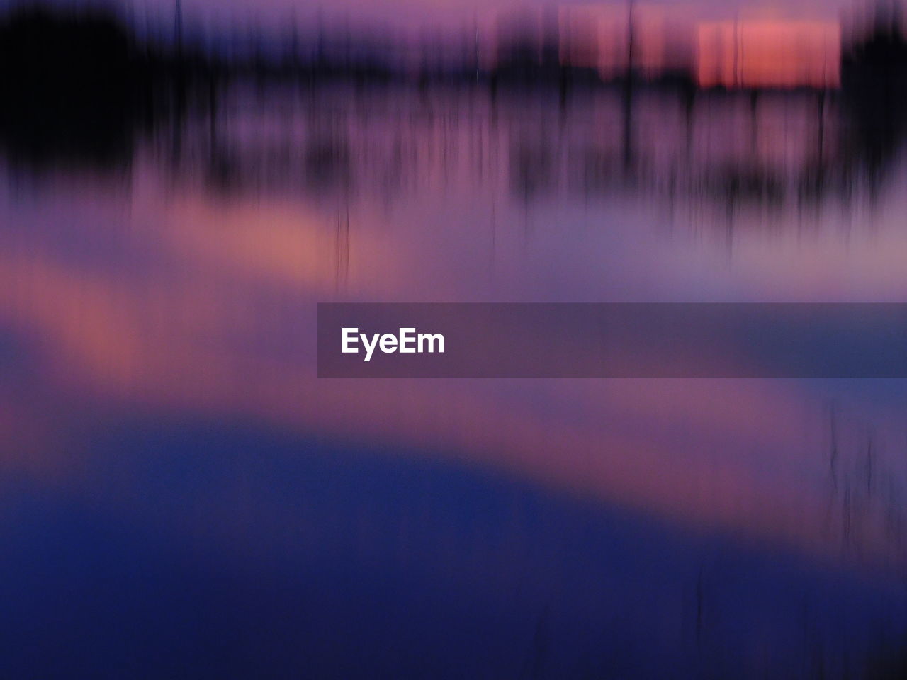 REFLECTION OF LANDSCAPE IN LAKE