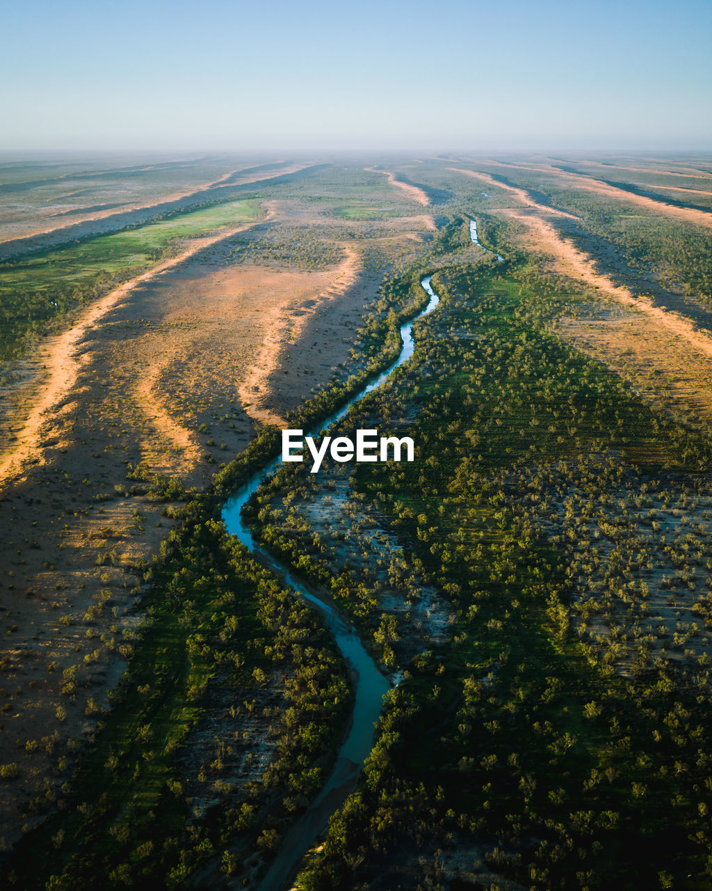 Aerial view of land against sky