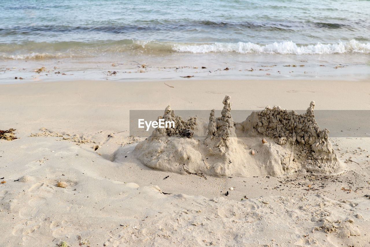 Sand castle on the beach, men du beach in carnac, brittany, france