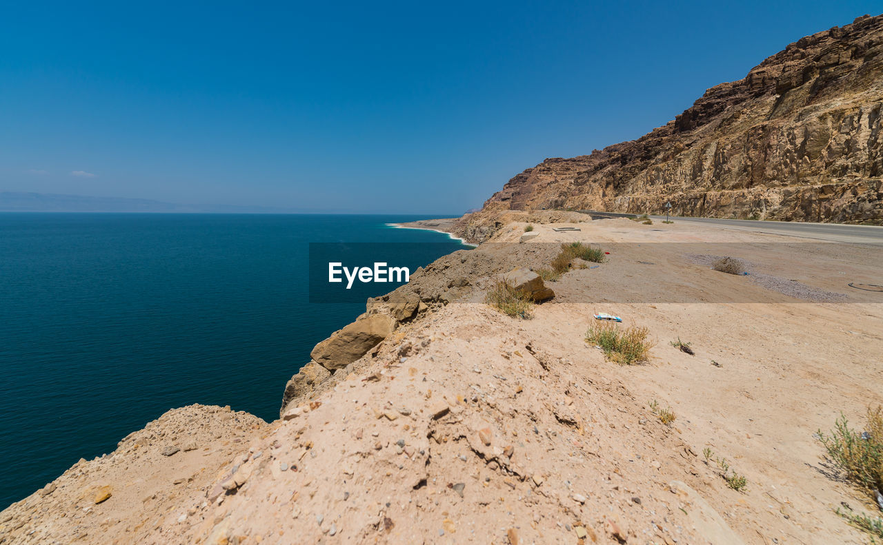 Scenic view of sea against blue sky