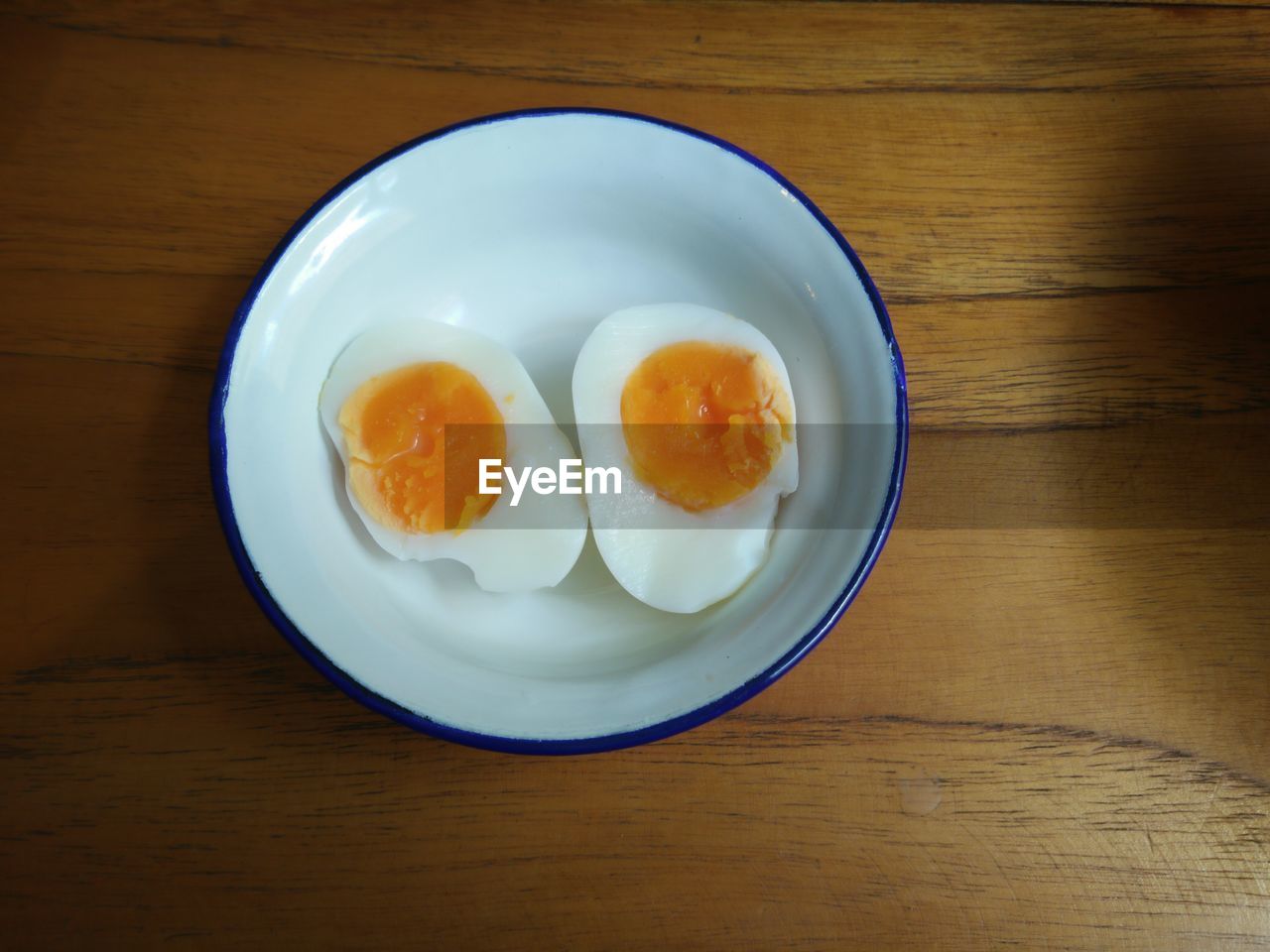 High angle view of boiled egg in bowl on table