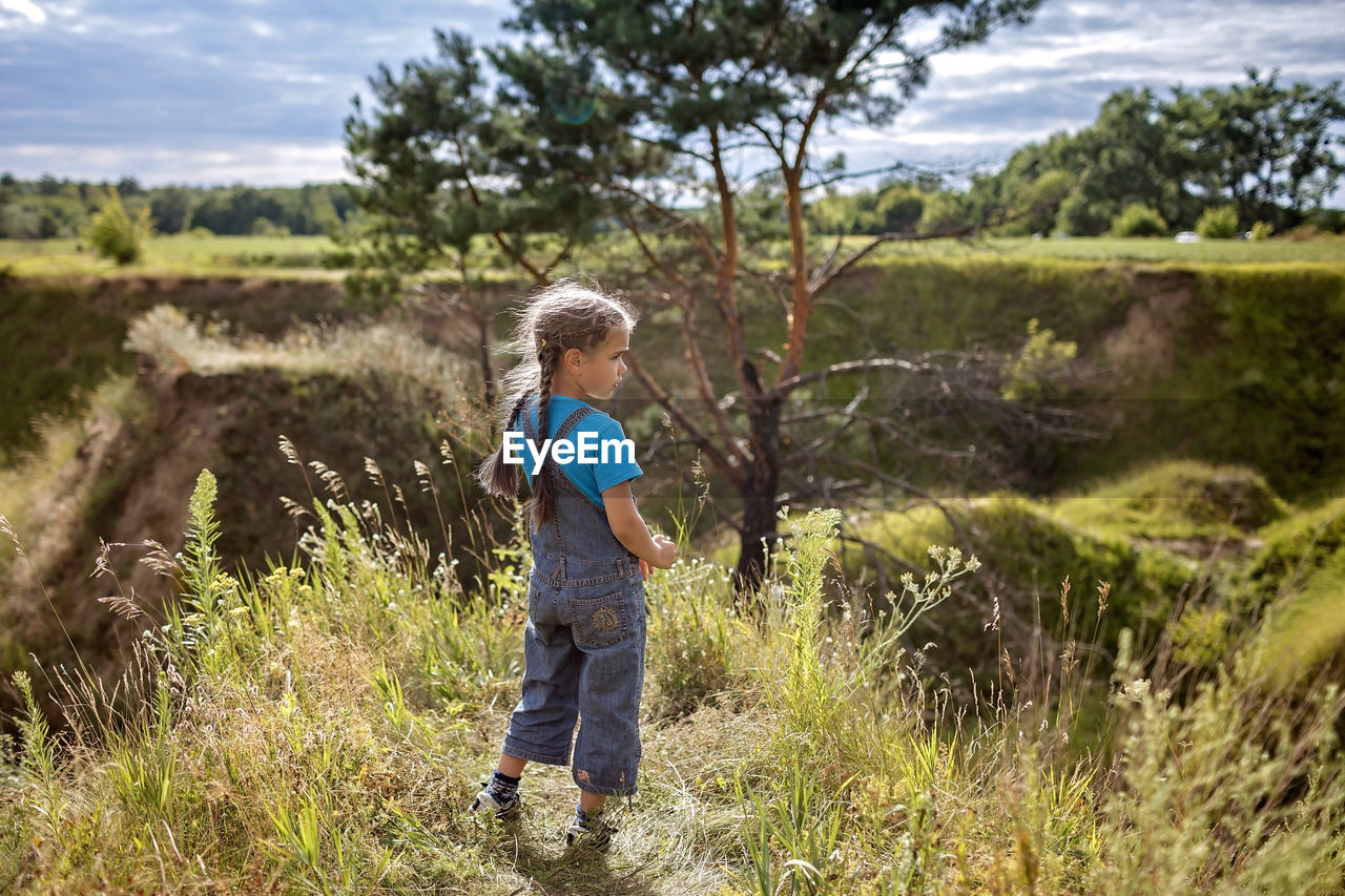 Full length of boy on field