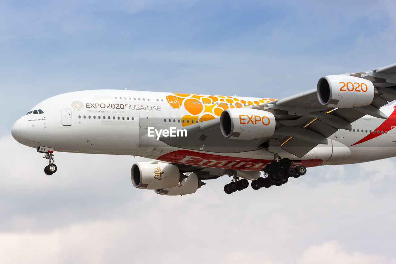 LOW ANGLE VIEW OF AIRPLANE AGAINST THE SKY