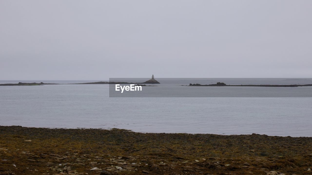 SAILBOAT IN SEA AGAINST CLEAR SKY