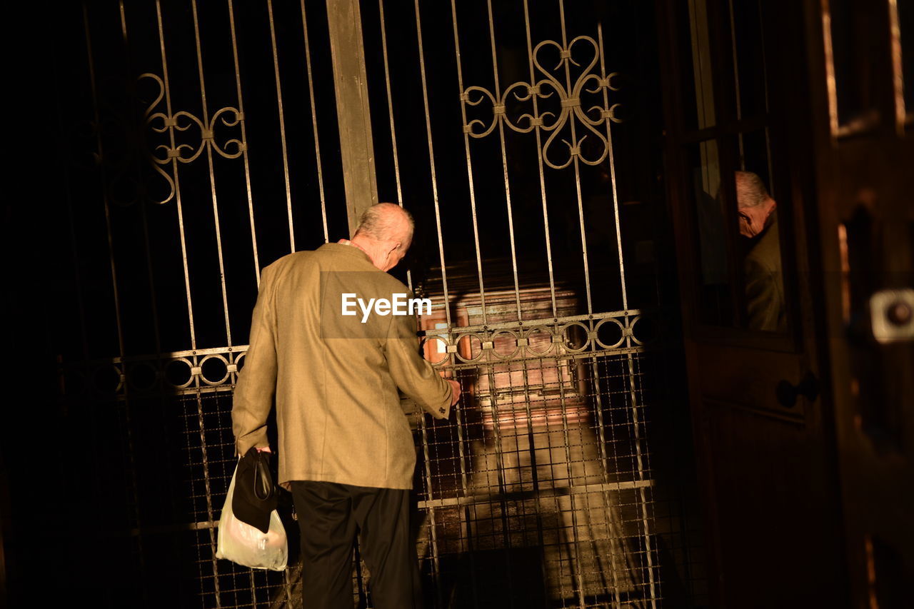 MAN WORKING ON METAL STRUCTURE IN STAGE