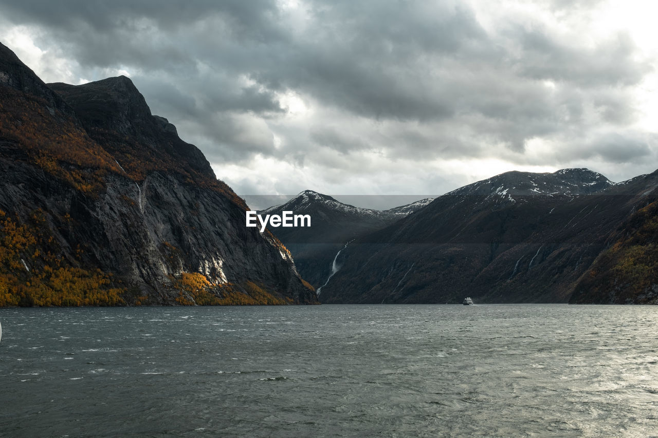 SCENIC VIEW OF MOUNTAINS AGAINST SKY DURING WINTER