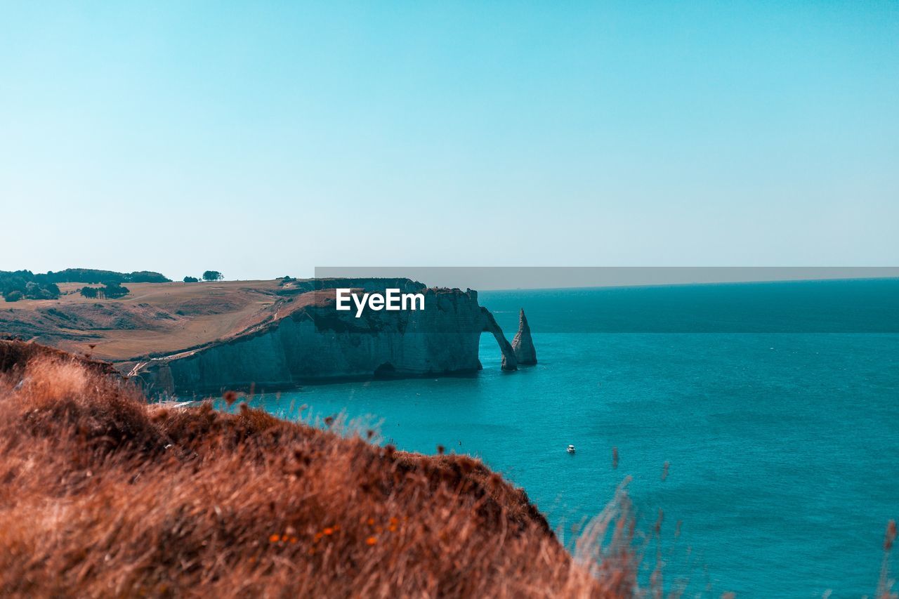 Scenic view of sea against clear sky