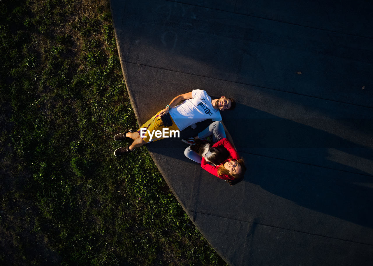 High angle view of man jumping on road