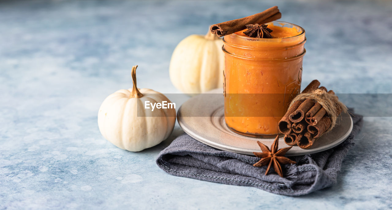 Organic pumpkin or sweet potato puree with spices. ingredient for making autumn or winter food.