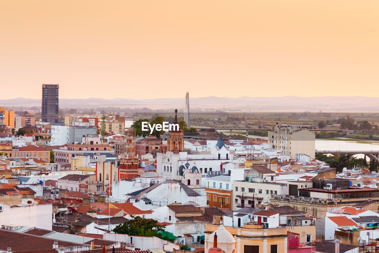 High angle view of town against sky during sunset