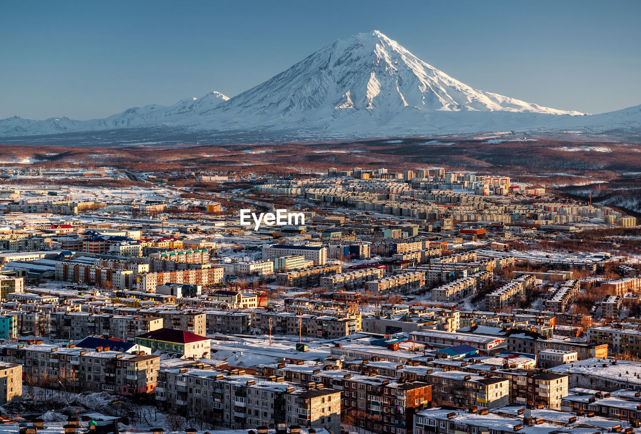 View of townscape and mountain during winter