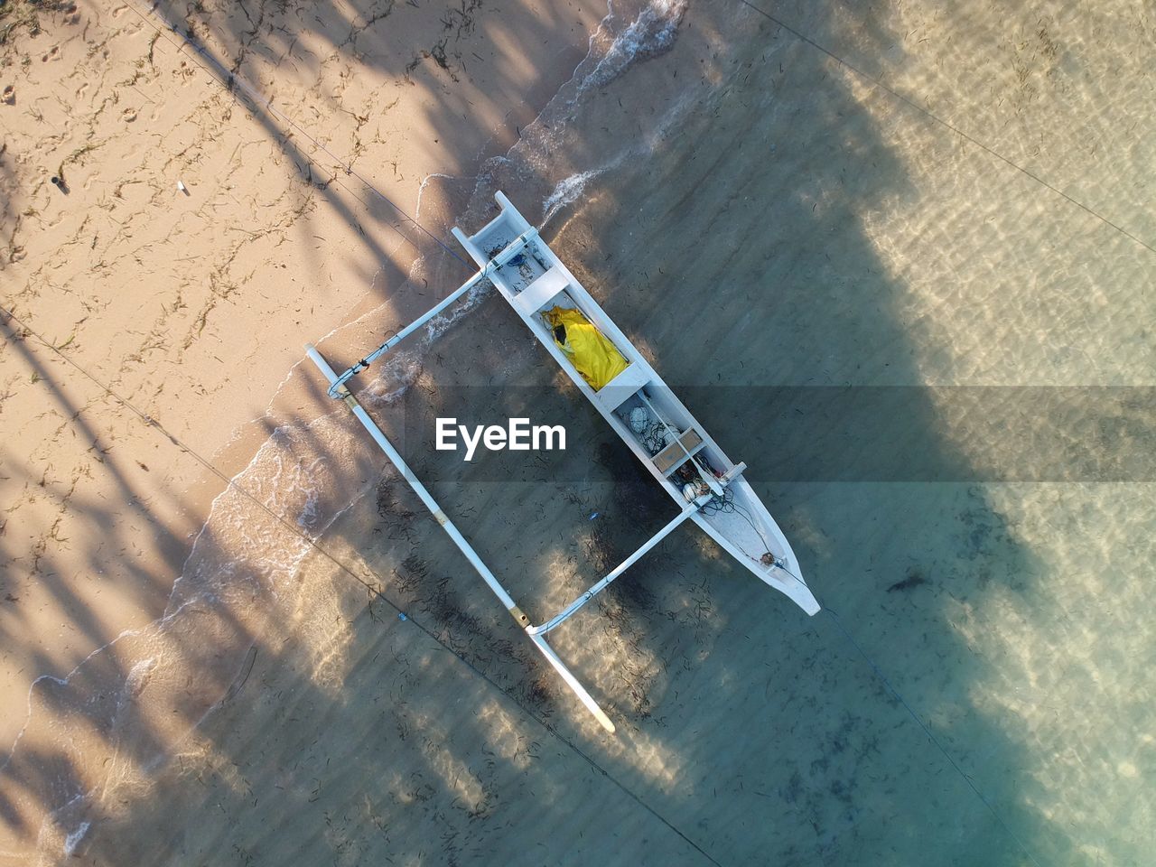 High angle view of boat on sand at beach