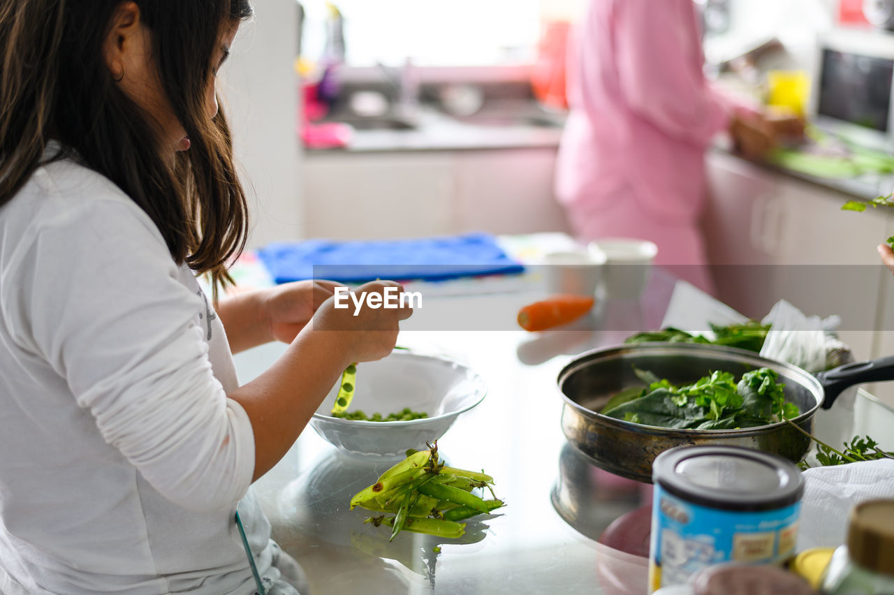 Little girl helping in the kitchen