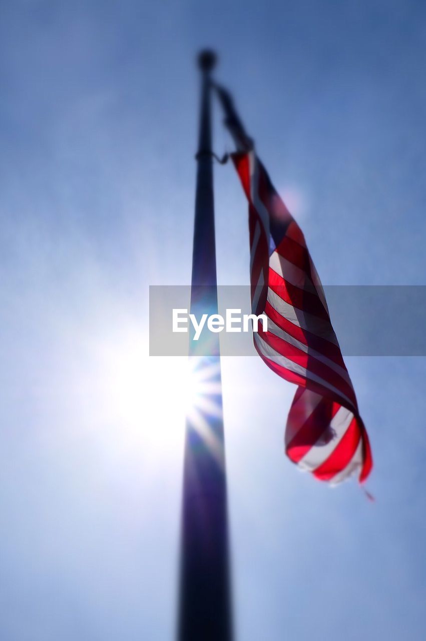 Low angle view of flag against sky