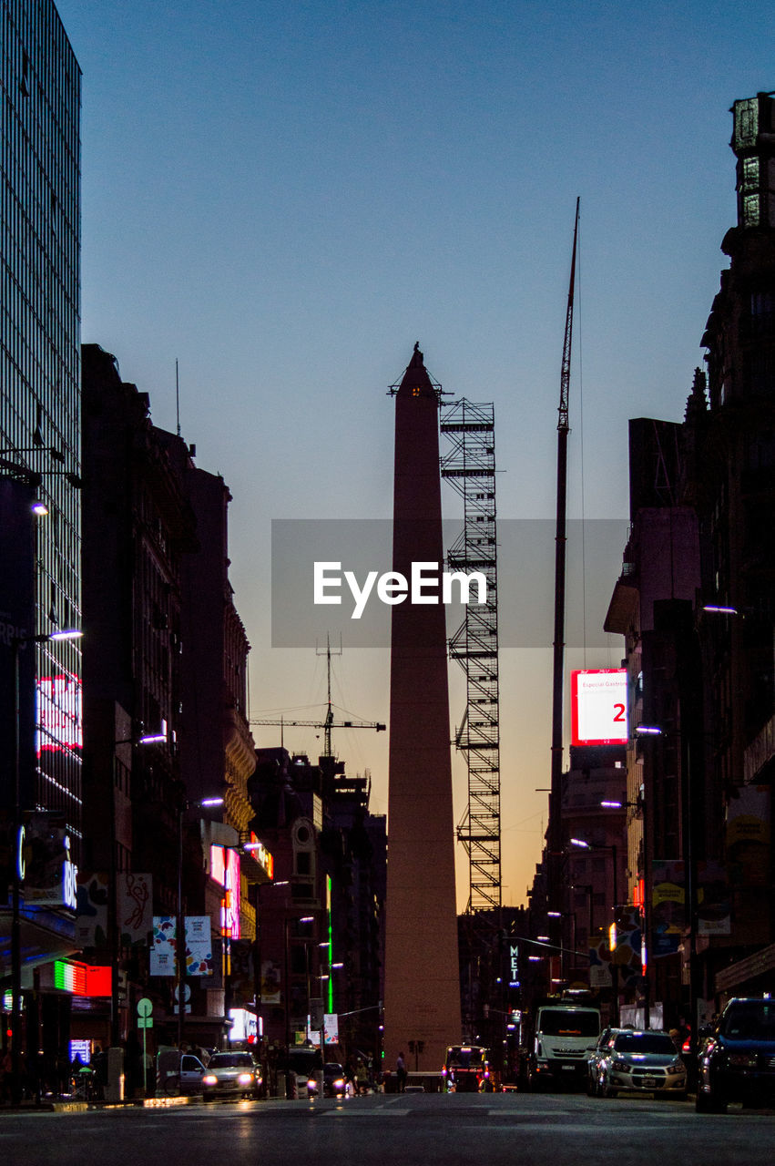 CITY STREET AND BUILDINGS AGAINST CLEAR SKY