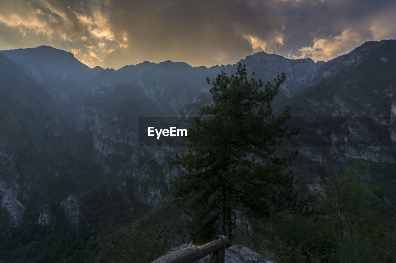 Scenic view of mountains against sky at night