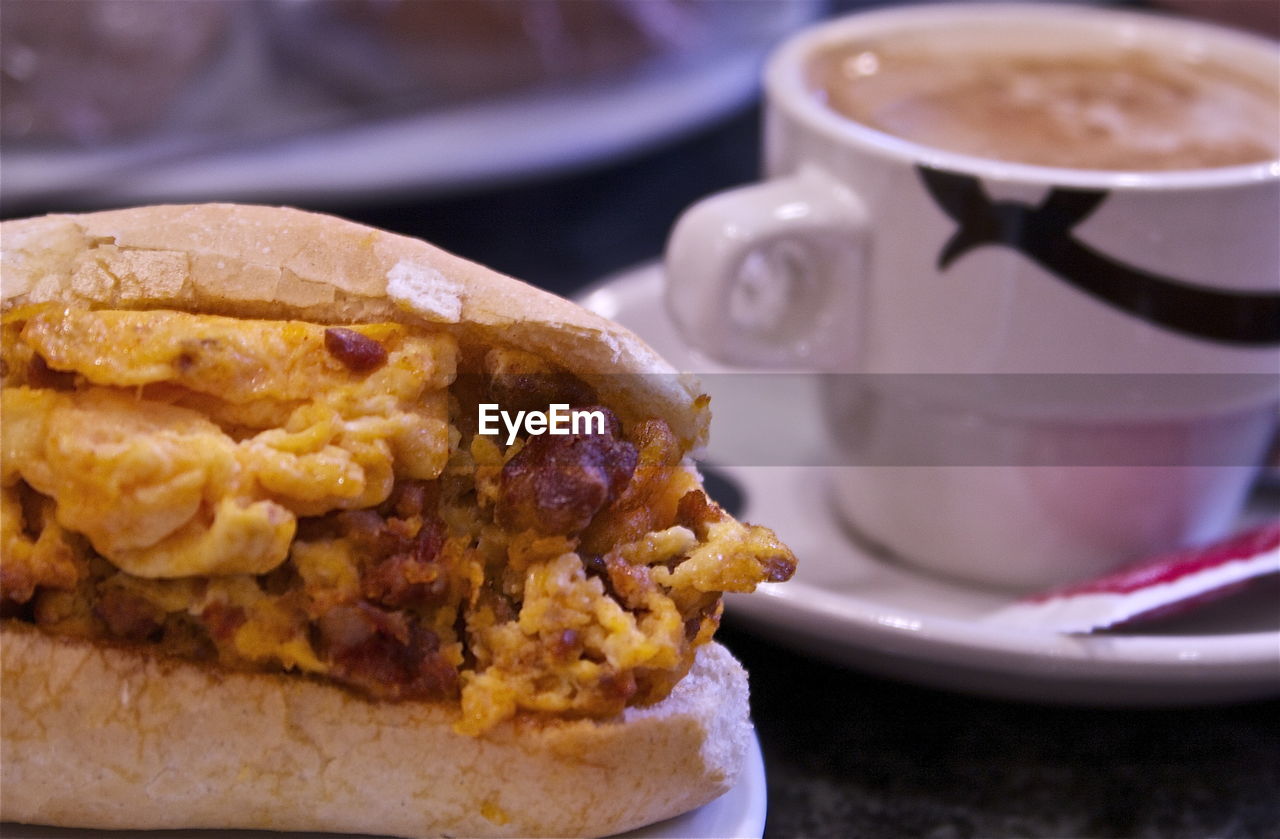 Close-up of food with coffee served on table