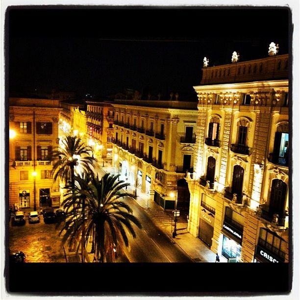 VIEW OF ILLUMINATED BUILDINGS AT NIGHT