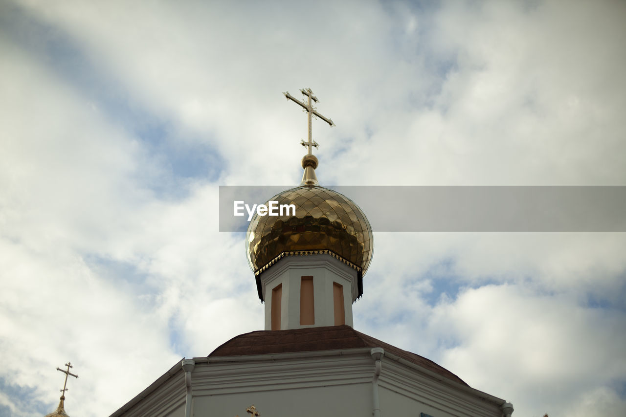 LOW ANGLE VIEW OF BELL TOWER AGAINST BUILDING