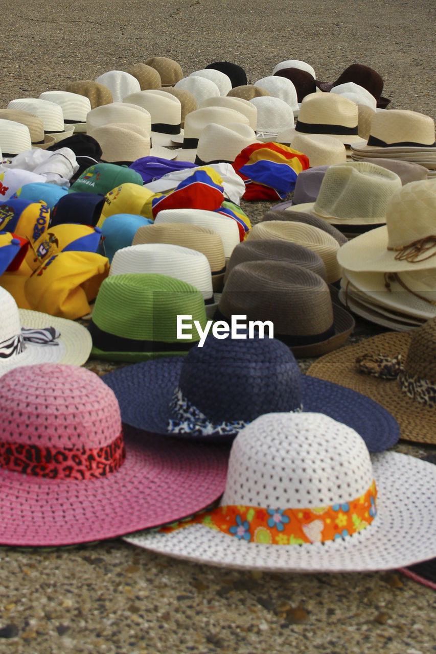 Close-up of colorful hats for sale in market