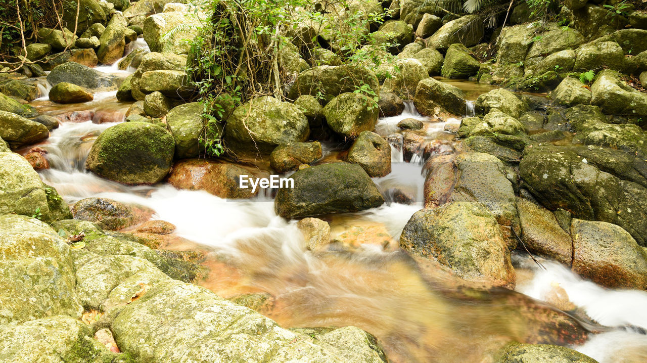 Stream flowing through rocks