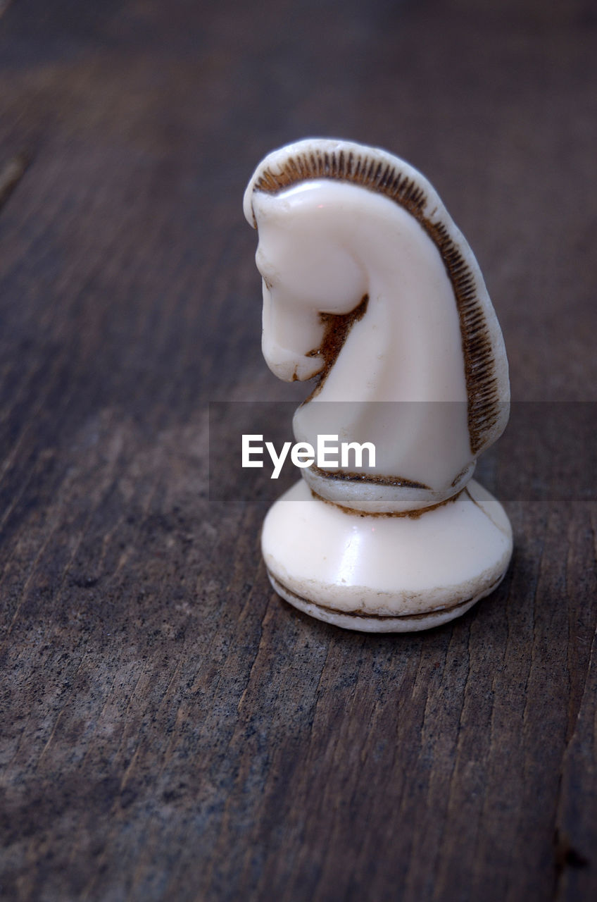 Close-up of chess piece on table