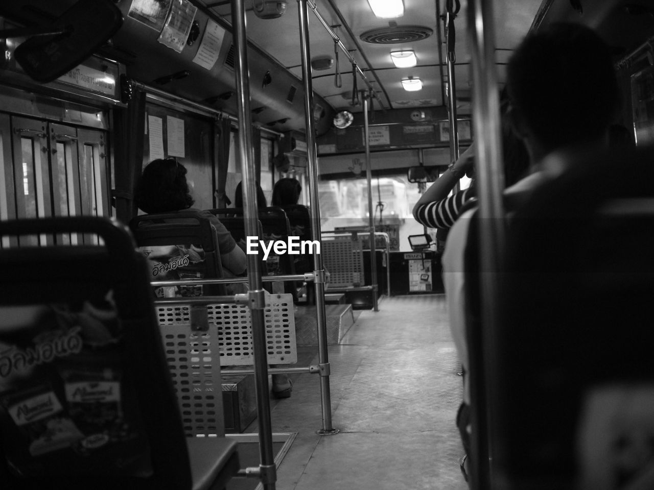 REAR VIEW OF PEOPLE WAITING AT TRAIN