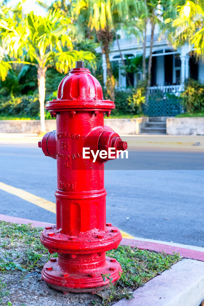 RED FIRE HYDRANT ON FOOTPATH