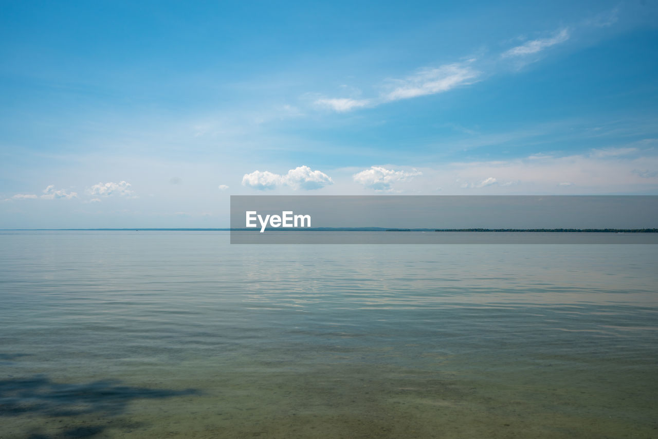 Scenic view of sea against blue sky