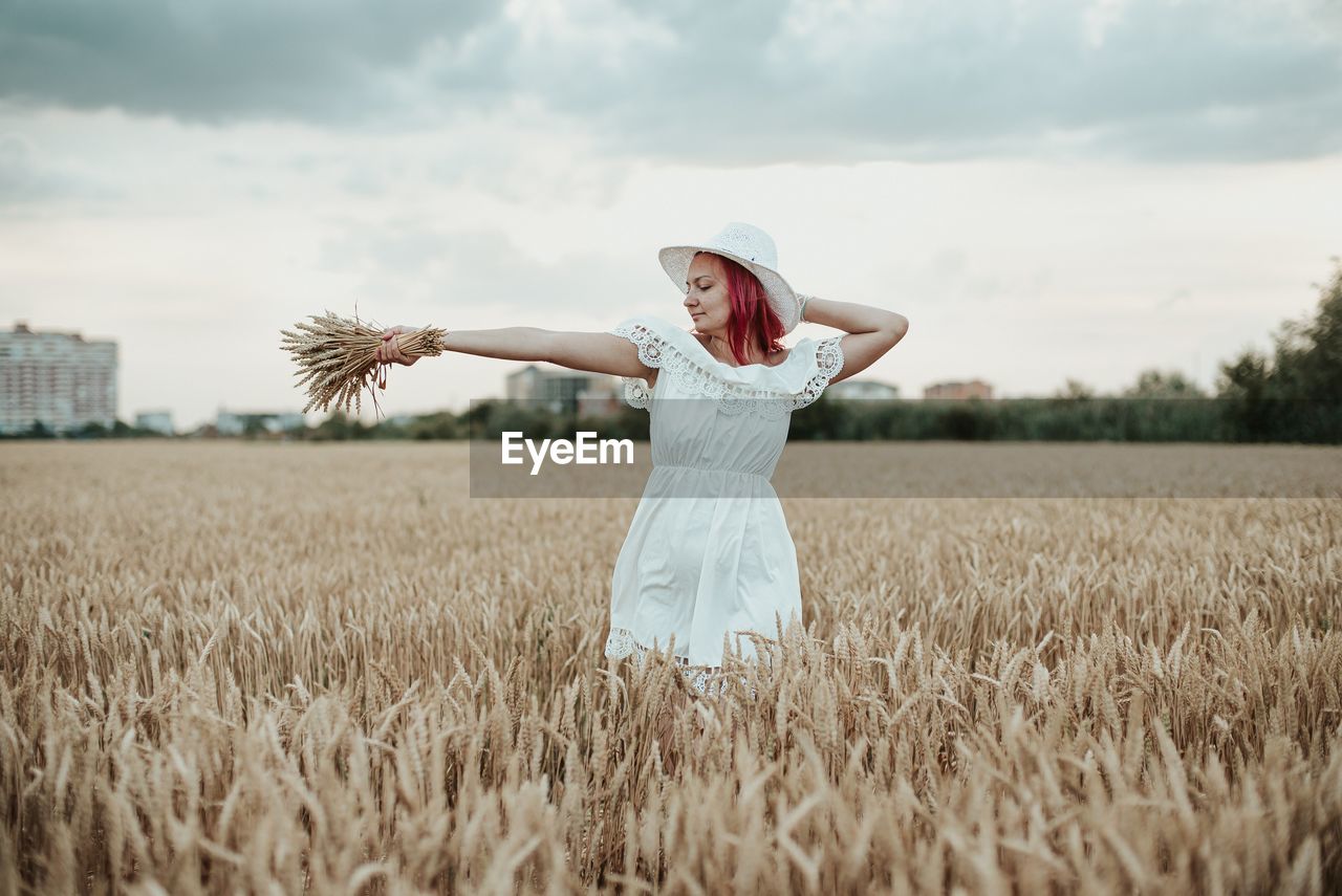 Woman standing in field