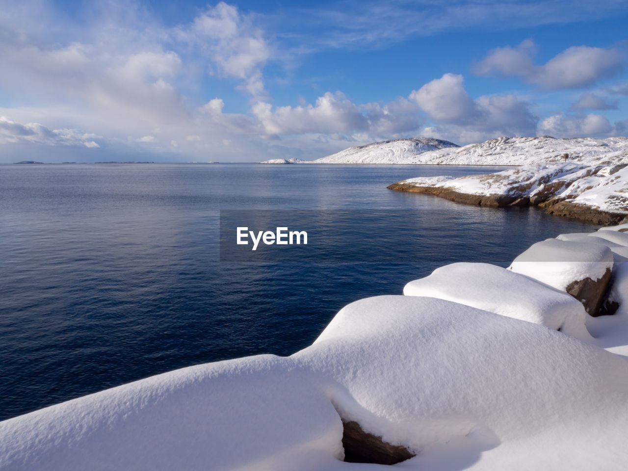 Scenic view of sea against sky during winter