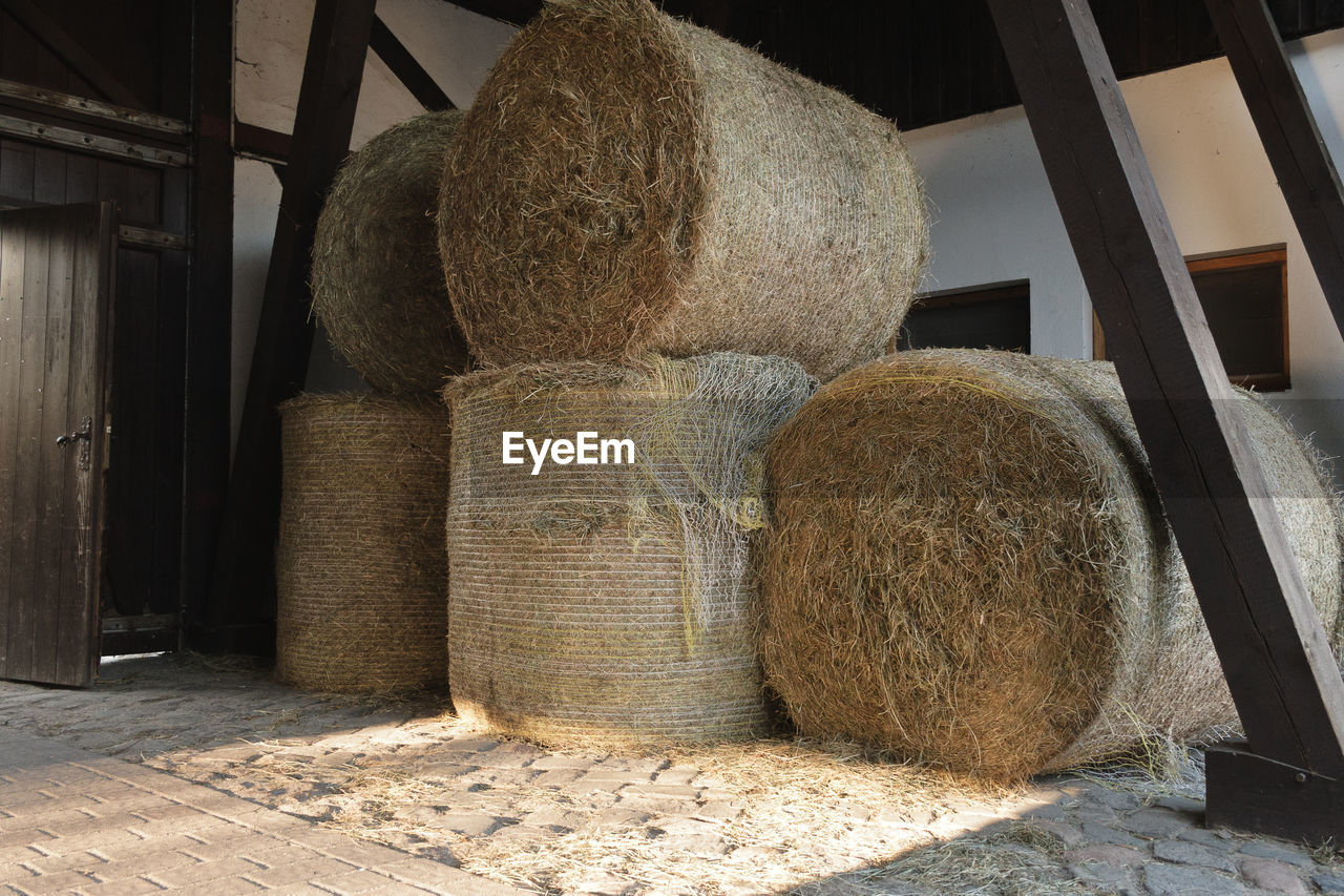 Stack of hay bales on field