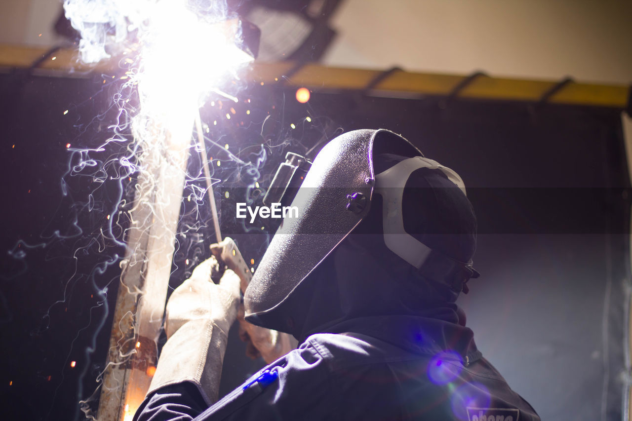 Man working on metal in workshop