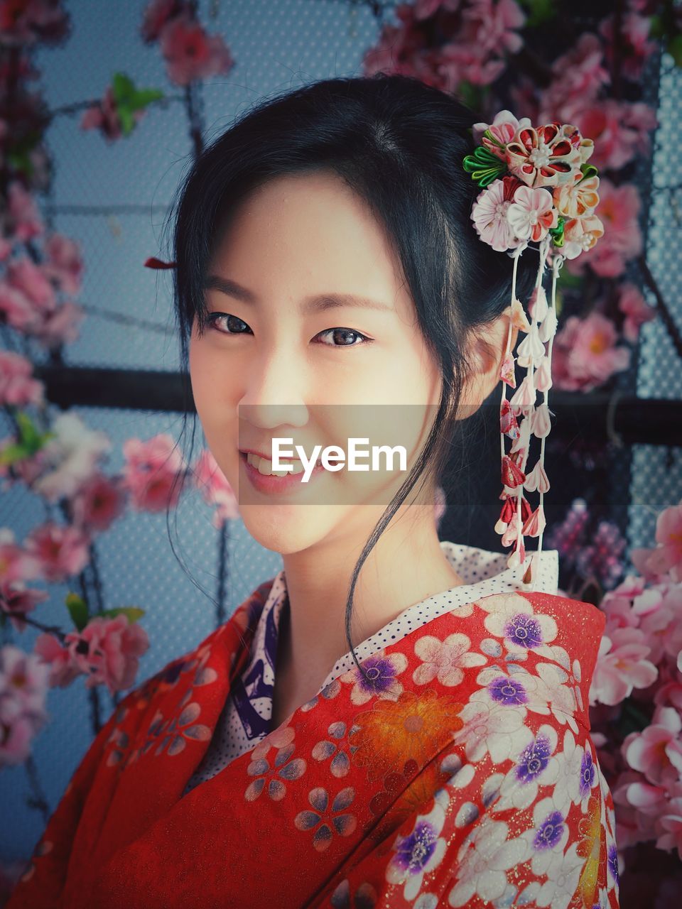 Portrait of smiling teenage girl wearing kimono