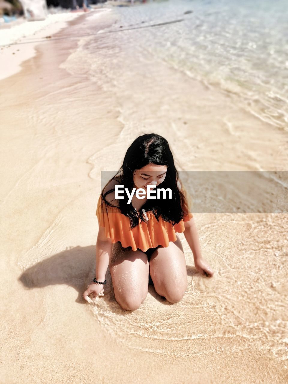 Woman sitting on beach