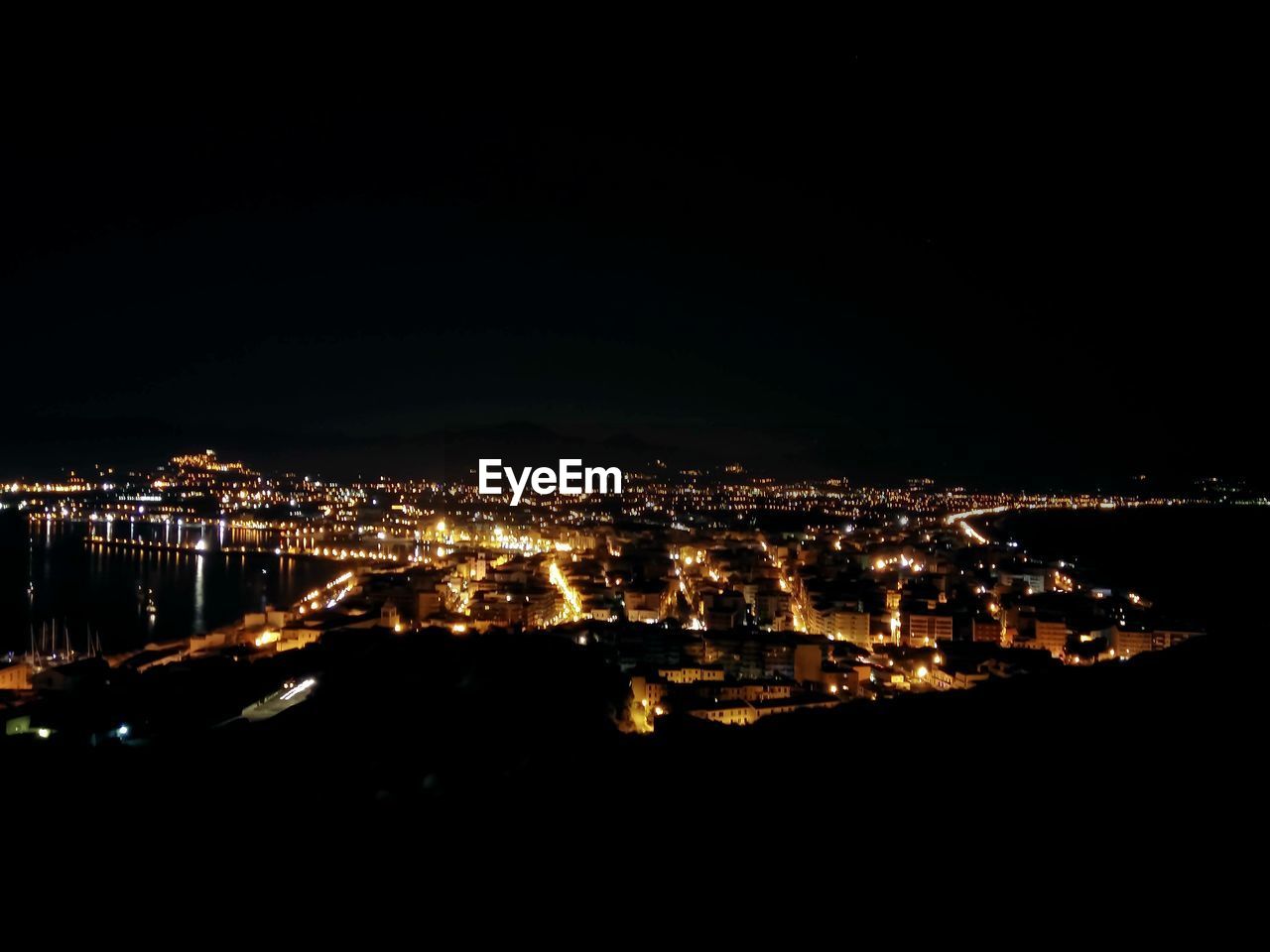 ILLUMINATED CITYSCAPE AT NIGHT