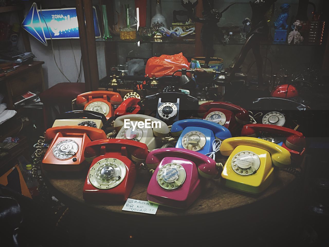 High angle view of old-fashioned landline phones in antique shop