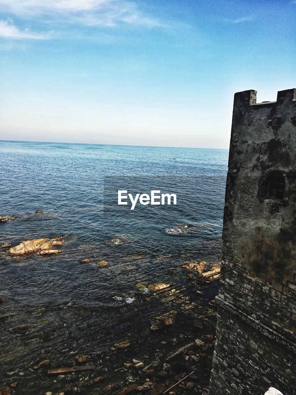 SEA AGAINST CLEAR BLUE SKY